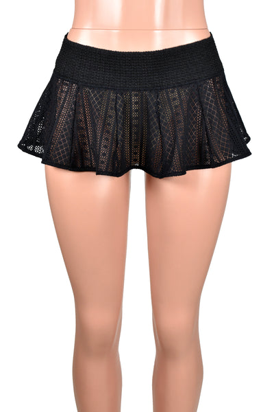 Mannequin wearing Sheer Black Stripe Pattern Micro Mini Skirt. Skirt is flared with a wide opaque elastic waistband.