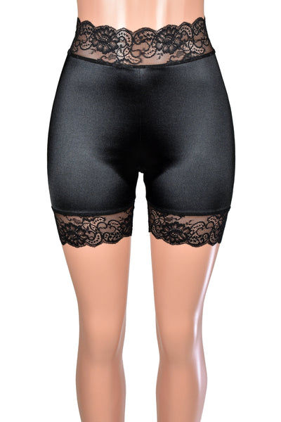 Mannequin wearing black satin shorts with scalloped lace waistband and hem