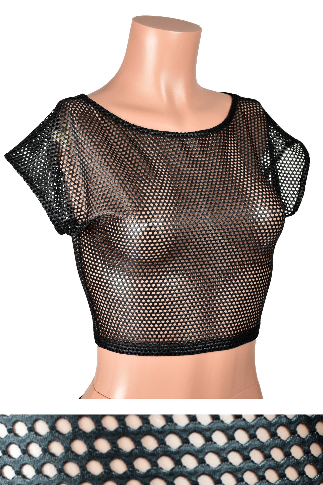 Mannequin wearing Black Shiny Net Fishnet Crop Top. Top has black elastic trim around the wide neckline, cap sleeves, and waist. Net fabric has a grid of small holes.