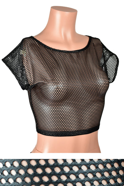Mannequin wearing Black Shiny Net Fishnet Crop Top. Top has black elastic trim around the wide neckline, cap sleeves, and waist. Net fabric has a grid of small holes.